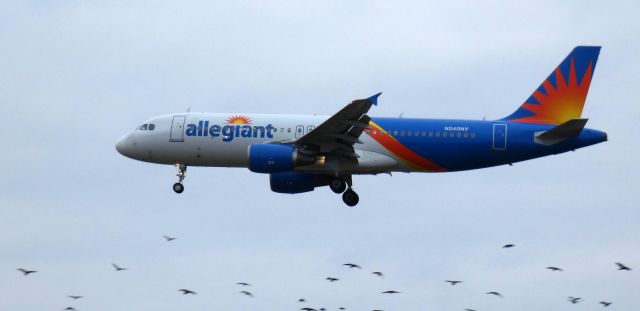 Airbus A320 (N240NV) - About to touch down is this 2000 Allegiant Airbus 320-214 on New Years Eve 2024.