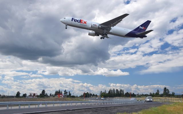 BOEING 767-300 (N271FE) - Landing - not landing. A brand new Boeing 767-300 flying a low approach over Runway 21 at Spokane International Airport. It looked like it was going to land, then the engines revved back up, the landing gear came up and it flew off. It then came back for a touch-and-go before heading back to Everett. Apparently flight testing.