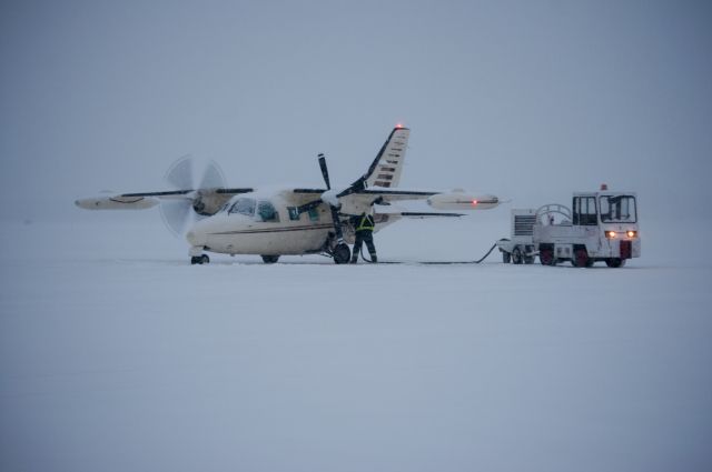 Mitsubishi MU-2 (N750CA) - Heading across the pond on a snowy day.