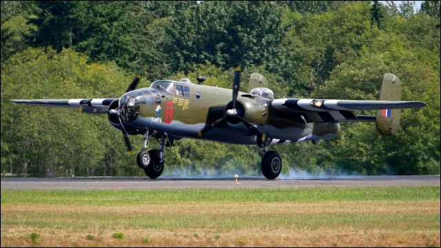 North American TB-25 Mitchell (N88972) - SkyFair 7.21.18: #N88972 - North American B-25D Mitchell bomber. (Ser#43-3318) (Mfr 1943). “Grumpy” makes tire smoke on landing Rwy 34L.