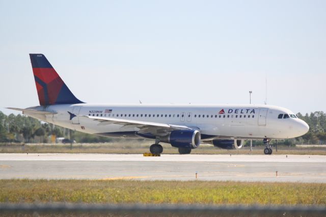 Boeing 737-800 (N328NW) - Delta Flight 2301(N328NW) taxis for departure from Southwest Florida International Airport prior to a flight to Northern Kentucky International Airport