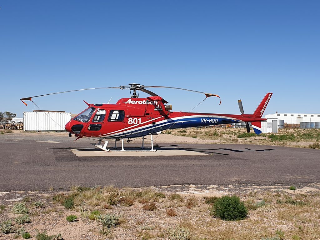 VH-HQO — - AS350 sitting on helipad at Moomba
