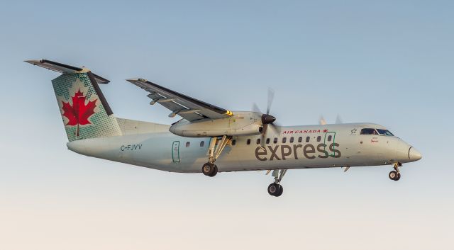 de Havilland Dash 8-300 (C-FJVV) - The Dash 8-300s were usually operated in Western Canada but have been making their way East over the past few months. Here JZA8612 is on short finals for runway 23 at YYZ after the flight from Greater Sudbury (CYSB)