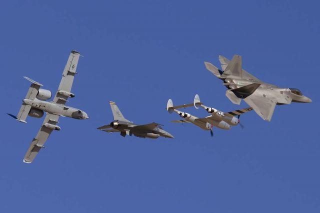 Lockheed F-22 Raptor (91-4008) - US Air Force Heritage flight: Lockheed-Martin F-22A Engineering, Manufacture, and Development (EMD) Raptor 91-4008, Lockheed P-38J Lightning N7723C, Lockheed-Martin F-16D Fighting Falcon 80-0553, and Fairchild-Republic OA-10A Thunderbolt II 80-0279 at Edwards Air Force Base on October 17, 2009.