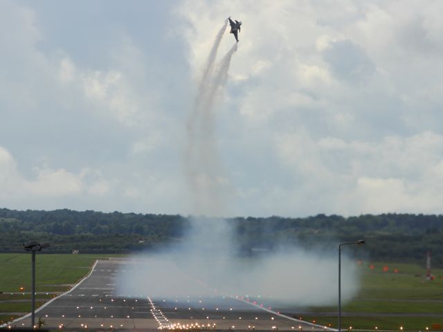 — — - This photo would not look out of place in the NASA archives. A Saab JAS 39C Gripen takes off, or should I say lifts off, to commence it's aerial display at Farnborough Airshow 2012.