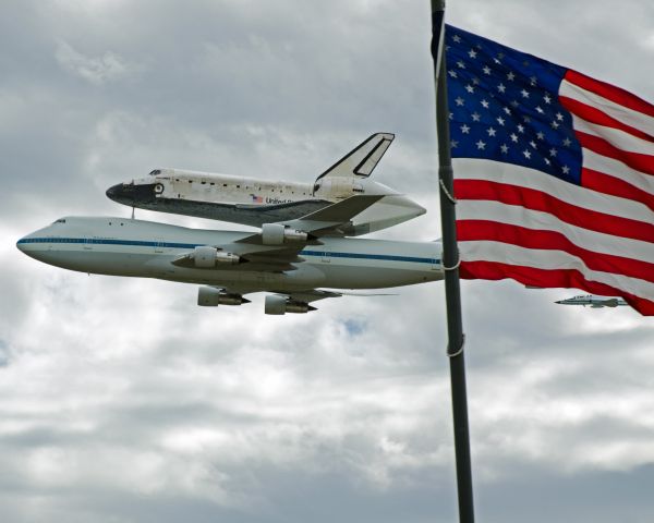 BOEING 747-100 (NASA905) - Standing on the top floor of the number one daily parking garage, looking as they made their first fly over before flying over downtown DC.