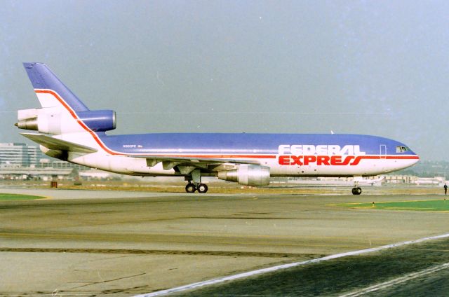 McDonnell Douglas DC-10 (N303FE) - KLAX - Federal Express dash 30 rolling off 25L at Los Angeles for the cargo ramp. Date apprx March 1990  CN:46802 LN:110