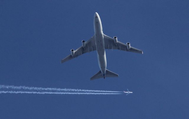 Boeing 747-200 (UNKNOWN) - A Cargolux B747 takes off to the West from Hartsfield Atlanta Airport as an American Airlines flight passes high overhead. 2017/12/04