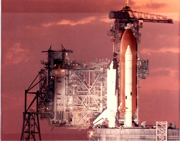 STS3 — - I took this photo while Columbia was poised for 3rd launch . I was in the press section with 35mm camera. Sorry for poor resolution of scan. Note main tank is no longer painted white to save weight.
