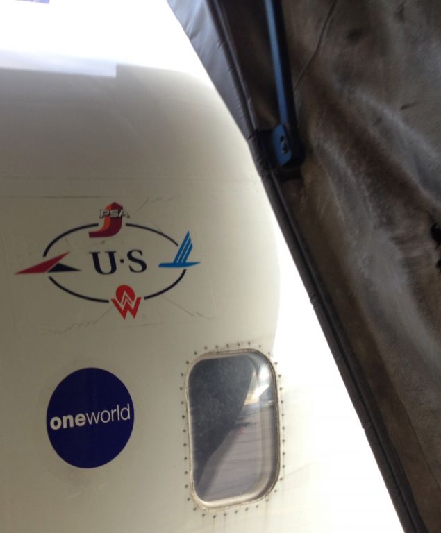 Canadair Regional Jet CRJ-200 — - Boarding a US Airways Express operated by Air Wisconsin at Detroit International Airport (KDTW) on July 24, 2014. Notice how the OneWorld Alliance logo is already on this plane.