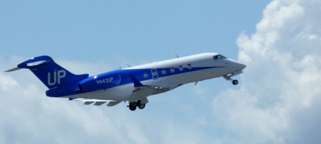 Bombardier Challenger 300 (N943UP) - Shortly after departure is this 2007 "Wheels Up" Bombardier Challenger 300 in the Spring of 2025.