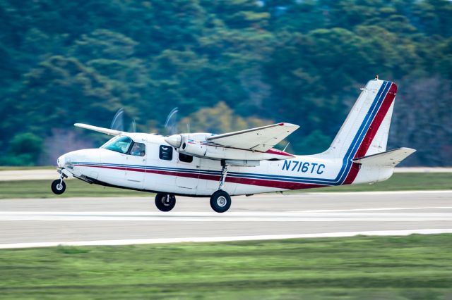 Aero Commander 500 (N716TC) - N716TC is a 1962 Aero Commander 500B seen here departing Atlanta's PDK executive airport. I shot this with a Canon 500mm lens. Please check out my other aviation photography. Votes and positive comments are greatly appreciated as that helps with my photography's popularity. Inquiries about prints or licensing of this photo can be sent to Info@Flews.com