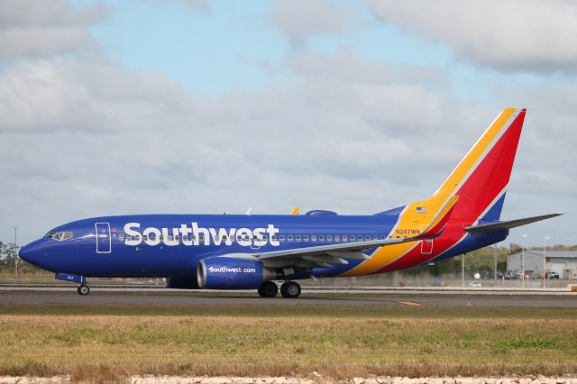 Boeing 737-700 (N247WN) - Southwest Flight 2328 taxis at Southwest Florida International Airport prior to flight to John Glenn Columbus International Airport (12/16/24)