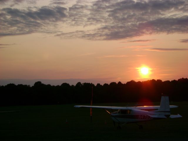 — — - A skydiver's sunset.