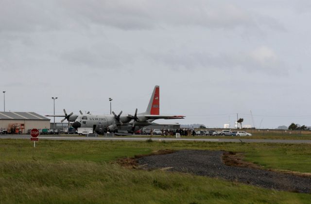 Lockheed C-130 Hercules (N63302) - 28 January 2014 on taking off from Invercargill New Zealand after re fuelling for Antarctica, N63302 had a bird strike, it returned and after 3 hours of examinations left again for Antarctica. This pictures shows Antarctic personal re boarding, best view full size.