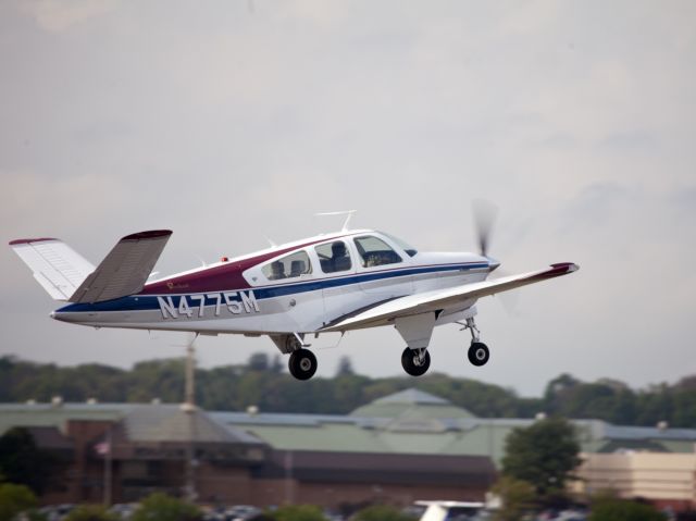 Beechcraft 35 Bonanza (N4775M) - Take off runway 08 at Danbury CT. A very nice V-tail Bonnie.