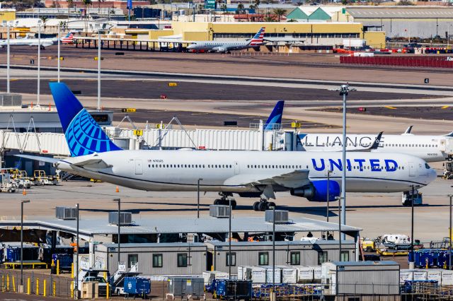 BOEING 767-400 (N76065) - A United Airlines 767-400 pushing back at PHX on 2/24/23. Taken with a Canon R7 and Canon EF 100-400 ii lens.