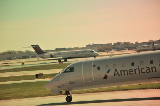 McDonnell Douglas MD-90 — - 10/14/16 outbound MD90 starts take-off roll, passing Eagle CRJ and United B737