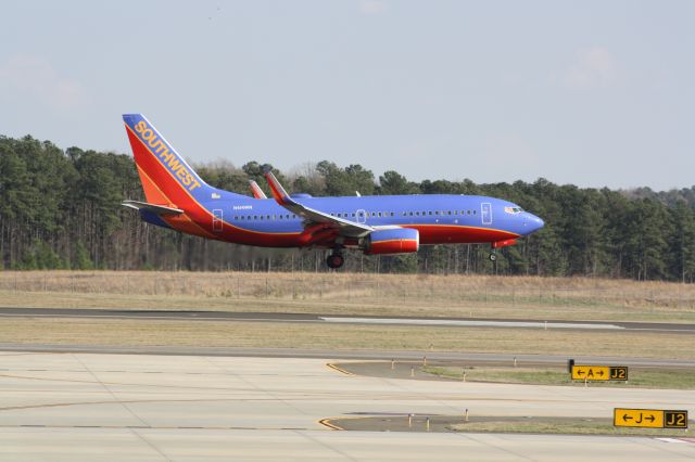 Boeing 737-700 (N414WN) - N414WN about to touch down runway 23L