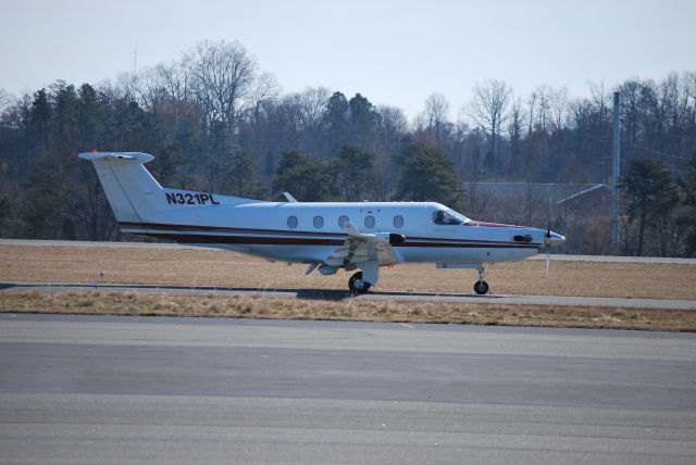 Pilatus PC-12 (N321PL) - Taxiing to runway 02 at Concord Regional Airport - 2/23/09