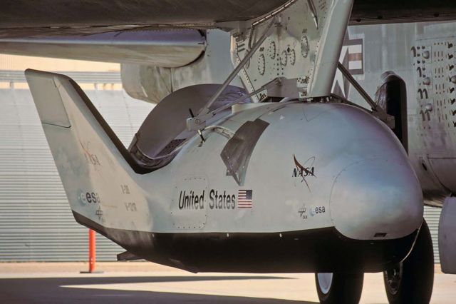 Experimental  (V132R) - X-38 V-131R Crew Return Vehicle hanging from the wing of the Boeing NB-52B Stratofortress before the seventh drop test of the program on June 29, 2001. The X-38 explored the flight characteristics of the lifting body shape before deploying a giant parafoil for a soft lading. The design was based on the Martin-Marietta X-24A.