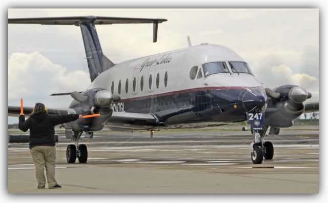 Beechcraft 1900 (N247GL) - Great Lakes Agent Amanda marshalls the Might Beechcraft 1900 from the Merced Passenger Terminal