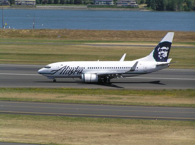 Boeing 737-700 (N626AS) - July 6, 2011, near midday. Departing 28R, inbound for gate.