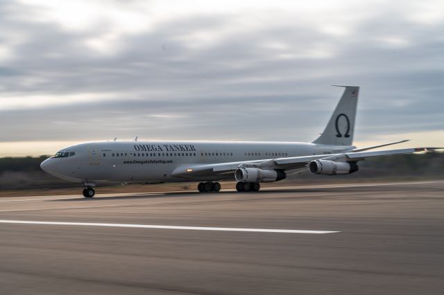 Boeing 707-100 (N707MQ) - Omega 707 heavy, taking off RWY 36R full lenght 12,500 ft. I was on RWY 9R, holding short 36R.