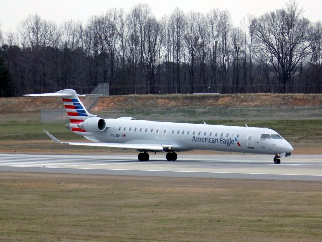 Canadair Regional Jet CRJ-900 (N562NN) - Photo taken from the observation area at KCLT. A bit of a cloudy day meant my camera struggled to grab enough light. Either way, it was a good enough shot I think.