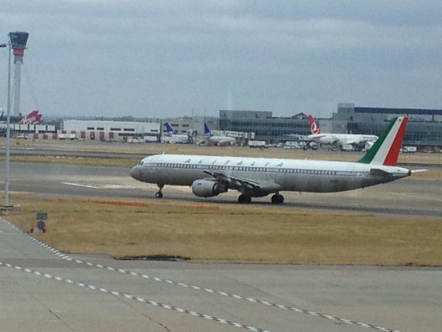 Airbus A321 (EI-IXI) - Alitalia A321 in retro livery.  Saw it from Terminal 4 at Heathrow