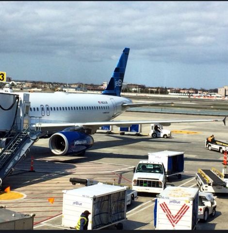 Airbus A320 (N624JB) - Preparing for departure for Kingston at gate 23 on April 17,2014