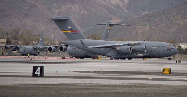 — — - Two C-17s and two C-130s were in Reno. The other C-130 was parked on Taxiway "Lima".