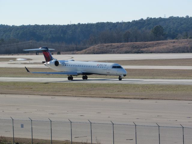 Canadair Regional Jet CRJ-700 (N738EV) - Delta Connection (ExpressJet) flight 5205 to Cleveland-Hopkins Intl, a Bombardier CRJ700 taxiing to takeoff on runway 23R. This was taken January 30, 2016 at 3:45 PM.