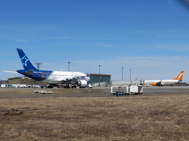 C-GLAT — - Air Transat and Sunwing both await passengers to take down to much warmer climates from Moncton, NB,  lucky people!  