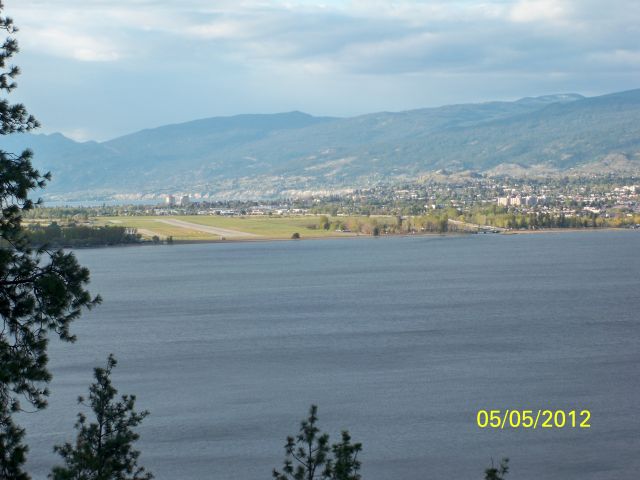 — — - PENTICTON REGIONAL AIRPORT YYF CANADA - Skaha Lake in foreground, The City of Penticton and Okanagan Lake in the background. Runway 34