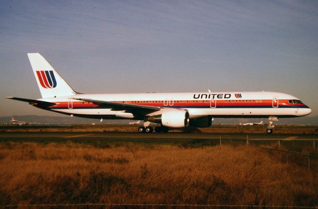 Boeing 757-200 (N544UA) - SFO - late PM photo from the access road by the 1L/R departure runways. This jet is new and the nice glossy paint shows well in this view.Unk date.