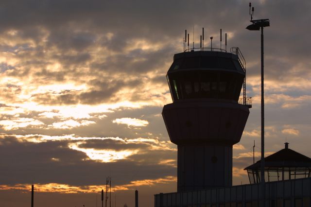 — — - Tower of MAA (Maastricht-Aachen-Airport). Right below the roof and windows of the old one.