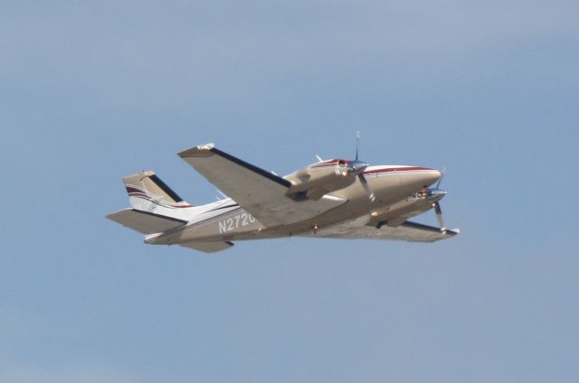 Beechcraft Baron (58) (N2720A) - N2720A departs Runway 14 at Sarasota-Bradenton International Airport enroute to Lakeland Linder Regional Airport