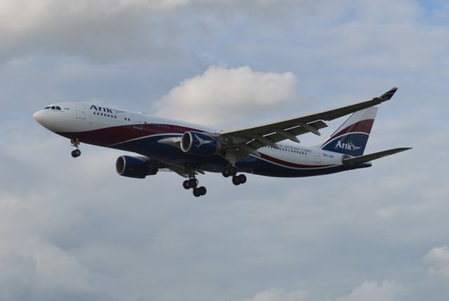 Airbus A330-300 (5N-JID) - Landing on runway 27L.