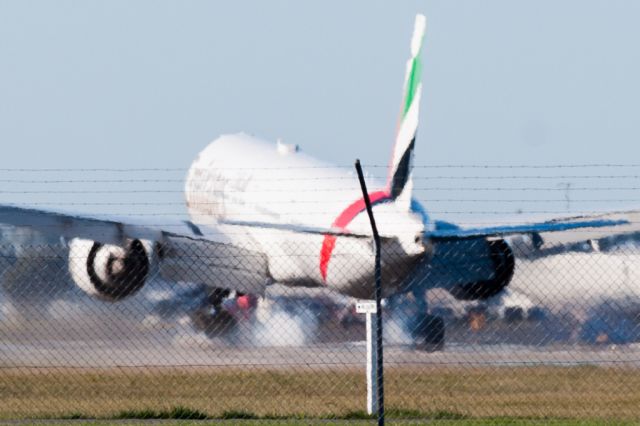 BOEING 777-300 (A6-EGH) - Touchdown, Runway 02 at Christchurch Airport on Sunday 24 April.