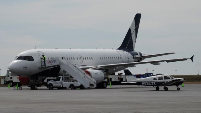 Airbus A319 (LX-MCO) - I was NOT expecting this to be here! LX-MCO, a plane from Luxembourg, all the way over at Buffalo. Also there's a PA28 in front taking a peek at it too... pretty cool!