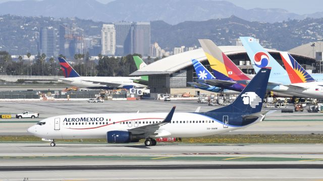 Boeing 737-800 (XA-AMW) - Taxiing to gate at LAX after landing on 25L