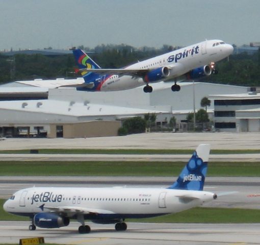 Airbus A320 — - Spirit A320 with JetBlue A320. Sorry for crappy quality.