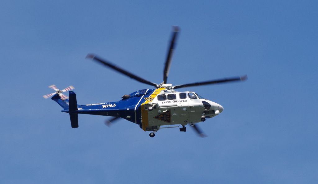 BELL-AGUSTA AB-139 (N7NJ) - MORRISTOWN, NEW JERSEY, USA-JULY 27, 2018: A New Jersey State Police helicopter, registration number N7NJ, is seen above Morristown Municipal Airport just prior to the arrival of President Donald J. Trump on board Air Force One. President Trump flew into Morristown on his way to his golf club in Bedminster, N.J., where he spent the weekend.