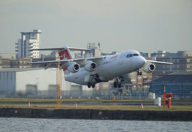 Avro RJ-100 Avroliner (HB-IXO) - Taken from Royal Albert Dock. 