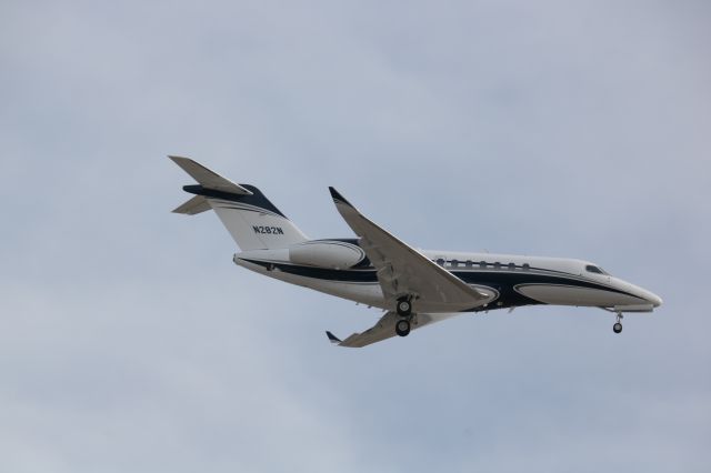 Cessna Citation Longitude (N282N) - Sam's Club parking lot approach end of 19L