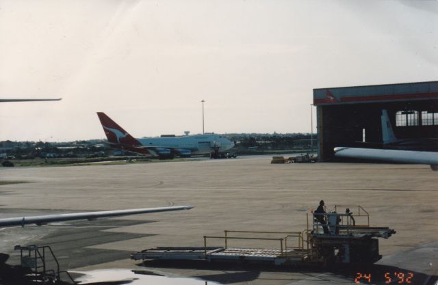 Boeing 747-200 (VH-EAB) - Th good old days here at Sydney airport the home of Qantas here we see a rare photo I had taken from the terminal 1998 of a Qantas 747SP jet awaiting next assignment Gone but not forgotten broken up 2001