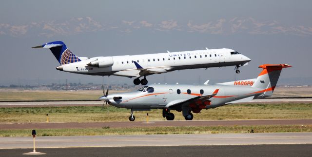 Canadair Regional Jet CRJ-700 (N796SK) - Arrival 34R. Pilatus in foreground is on taxiway Foxtrot.