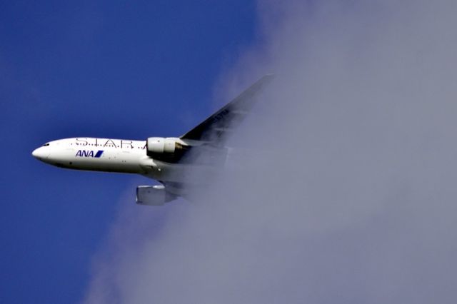 Boeing 777-200 (JA711A) - Emerging from clouds