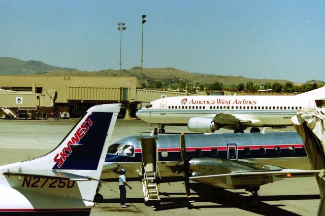 Fairchild Dornier SA-227DC Metro (N2725D) - KRNO - noon time ramp fun at Reno in Aug 1999.( for me) The America West 737-3 most likely arriving from PHX-Phoenix, AZ. I took this picture just because I knew 10-20years from then, this might interesting.